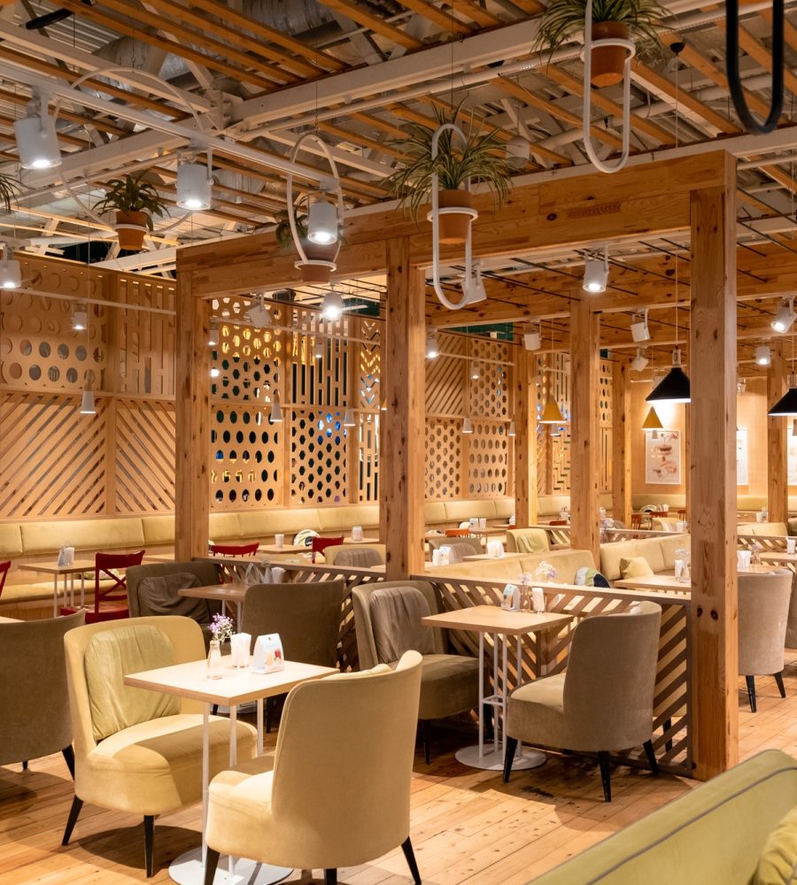 Loft style restaurant with textured wooden walls. Cafe in wooden style